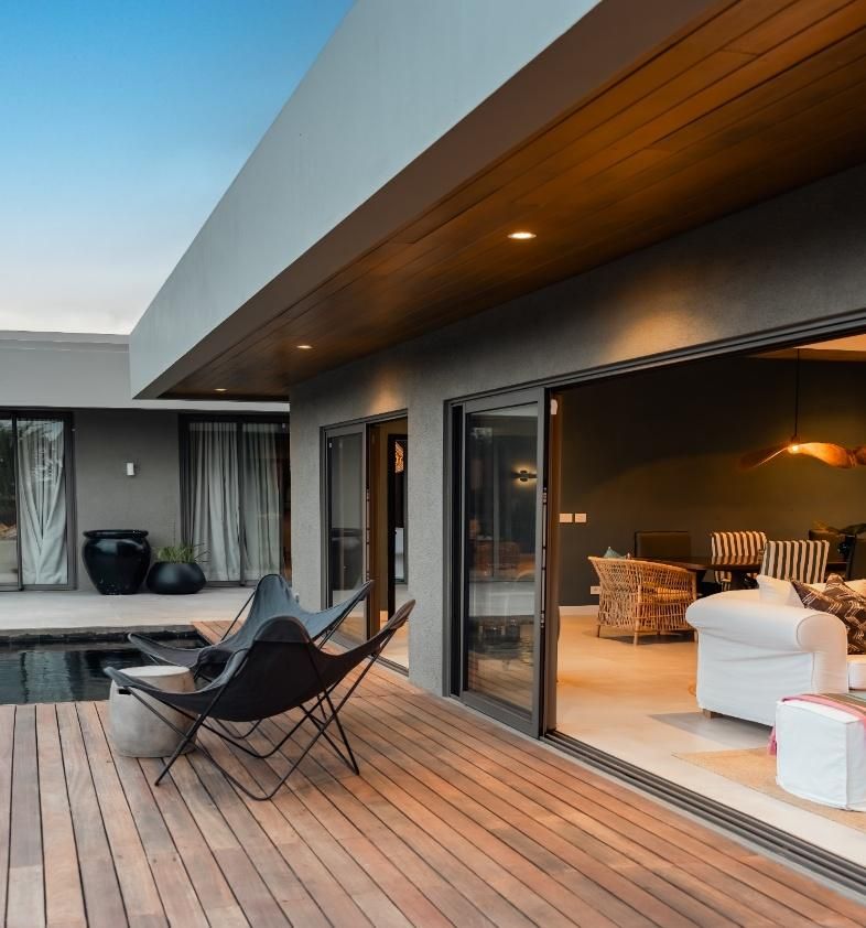 Timber deck and living area of a completed villa built by Fralex