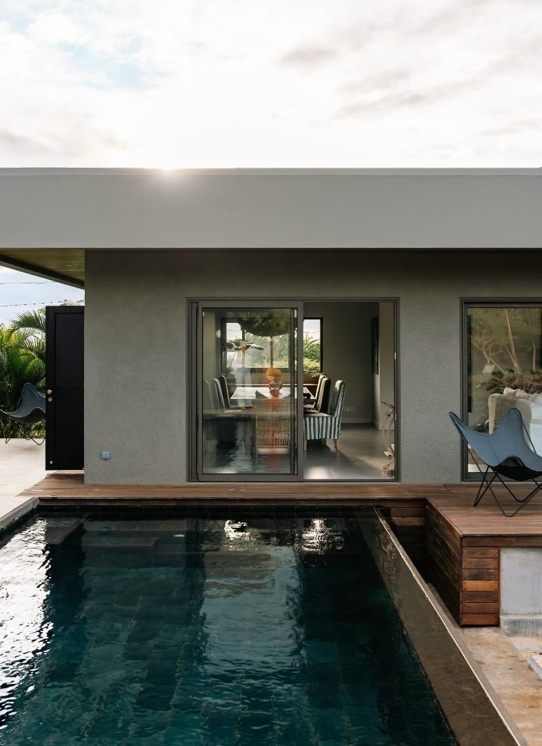 Pool and timber deck in front of the villa